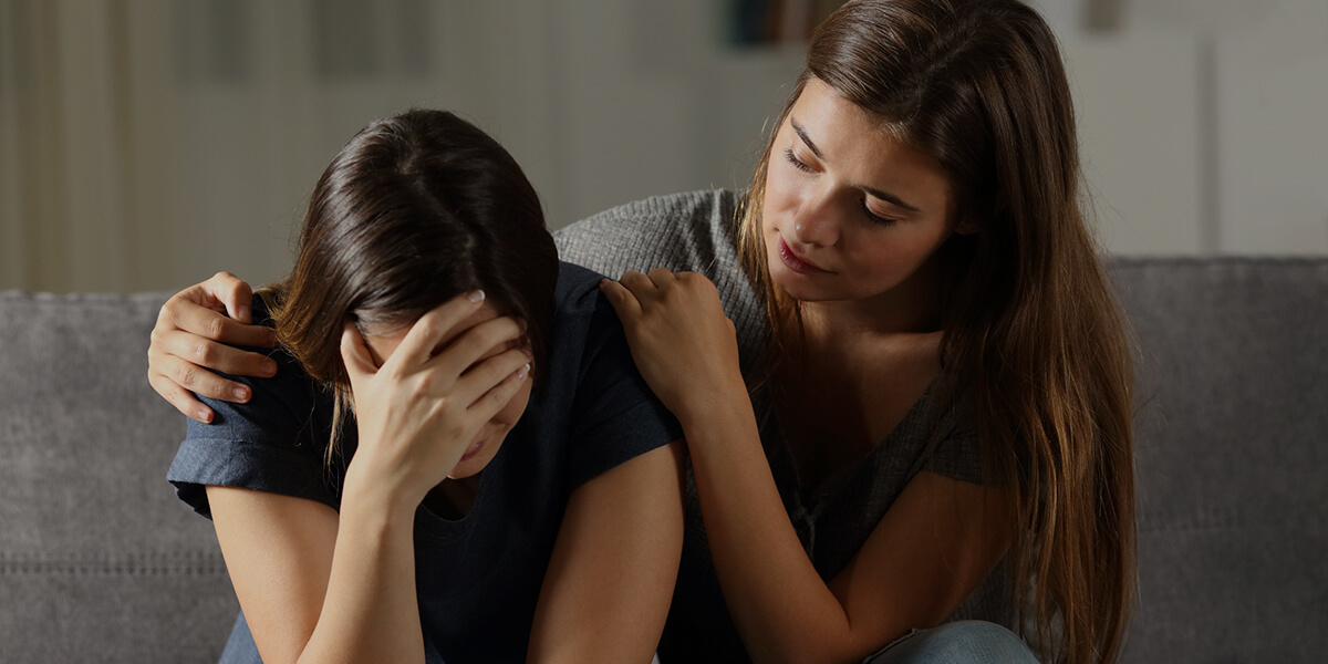 a women helping another women in distress